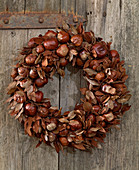 Door wreath of chestnuts and leaves