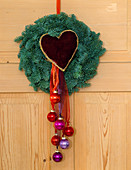 Door wreath made of Nobilistanne, tree balls and velvet heart