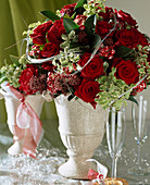 New Year's Eve bouquet with red roses, Skimmia (skimmia)