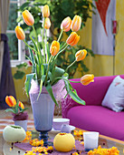 French tulips in light blue glass vase