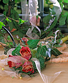 Rose petals in a sisal bag with Hedera (ivy), ribbons