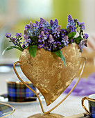 Heart vase of gold plate with muscari (grape hyacinths)