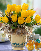 Yellow tulip bouquet with broom and feather cuff