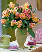 Tulipa 'Parrot' (tulips) in greenish vase