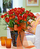 Red bouquet: Tulipa (tulips), Freesia 'Orangina' (freesias)