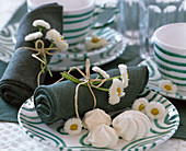 Bellis (white daisy) tied to a napkin with string