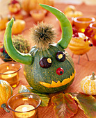 Cucurbita (ornamental gourd monster), Capsicum (peperonies) as horns, Aesculus (chestnuts as eyes)