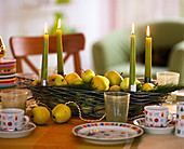 Elongated metal basket with candle holders
