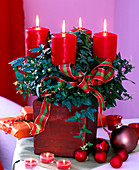Hedera (ivy) as Advent wreath with 4 red candles, ribbon, tree balls