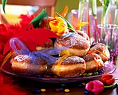Doughnuts with ribbon, glass plate