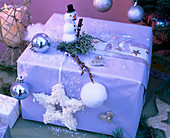 Gift with snowman, snowball, balls, stars, Cupressus (Arizona cypress)