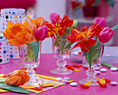 Small glasses and tulips (tulip flowers, chocolate lentils)