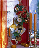 Christmas window decoration: brown bottles hung on willow ball, with golden E