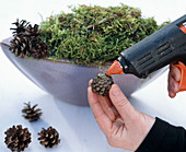 Bowl with cones and Christmas baubles (3/4) Glue cones with hot glue gun onto the