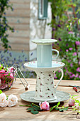 Homemade cake stand with rose petals