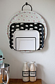 Trays in magazine rack hung on wall