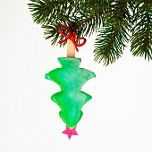 A tree-shaped ice lolly hanging from a Christmas tree