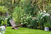 Flowerbeds and lawn in idyllic garden