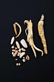 Ginseng roots in front of a black background