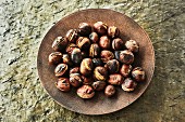 Roasted chestnuts in a bowl