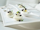 Russian eggs with herbs and caviar