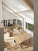 View down into open-plan living room in natural shades