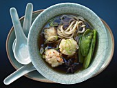 Shrimp ball soup with snow peas and mie noodles