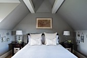 Double bed below roof beams