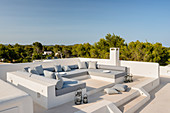 Masonry seating area on Mediterranean roof terrace