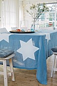 A blue tablecloth with large white stars