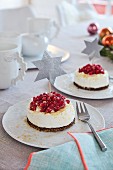 Small Advent cakes with pumpernickel and pomegranate seeds on a table