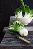 Pak Choi on wooden table with knife