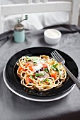 Spaghetti alla Norma with tomatoes, aubergine, grated parmesan and basil