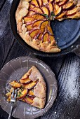 A crostata with sliced peaches