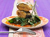 Fish with coconut, tamarind, fried ginger and spinach
