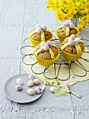 Hot cross muffin topped with chocolate mini eggs