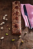 Vegan, gluten-free date strudel with pistachios and pecan nuts