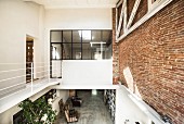 Gallery level in loft apartment with brick wall