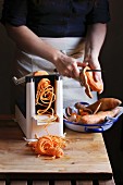 Making sweet potato noodle with a spiralizer machine