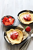 Cloud bread with cinnamon and fresh strawberries in tartlet tins