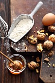 Ingredients for a nut cake: flour, honey, eggs and walnuts