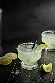 Margarita cocktail with salted rim glass, lime and tequilla