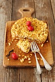 Apple crumble cake on a wooden board