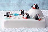 'Winter Wonderland' fondant icing cake with an igloo and penguins