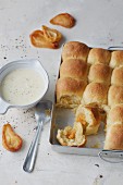 Sugar-free oven-baked yeast dumplings filled with pear jam and served with vanilla sauce