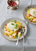 White chocolate mousse with saffron on an exotic fruit carpaccio
