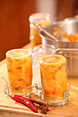 Pumpkin and apple chutney in a glass as a Christmas gift