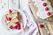 Cream cake with raspberries and fruit juice, sliced