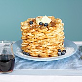 Waffles with butter, blueberries and maple syrup