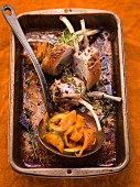 Pork chops with thyme and pumpkin in a roasting tin